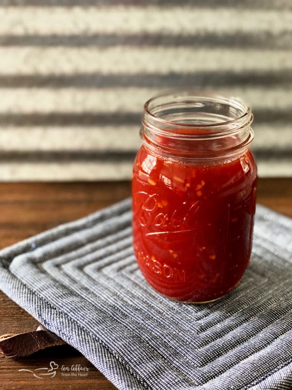 Jar of Homemade Barbecue Sauce on a grey potholder