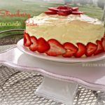Side View of Strawberry Lemonade Cake on a white square cake plate and text "Strawberry Lemonade Cake"