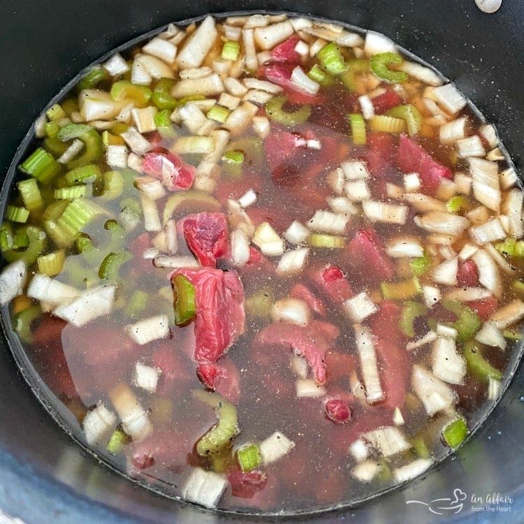 beef and vegetables cooking in pot