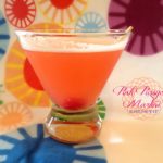 Pink PussyCat Martini in a martini glass with a multiple color background