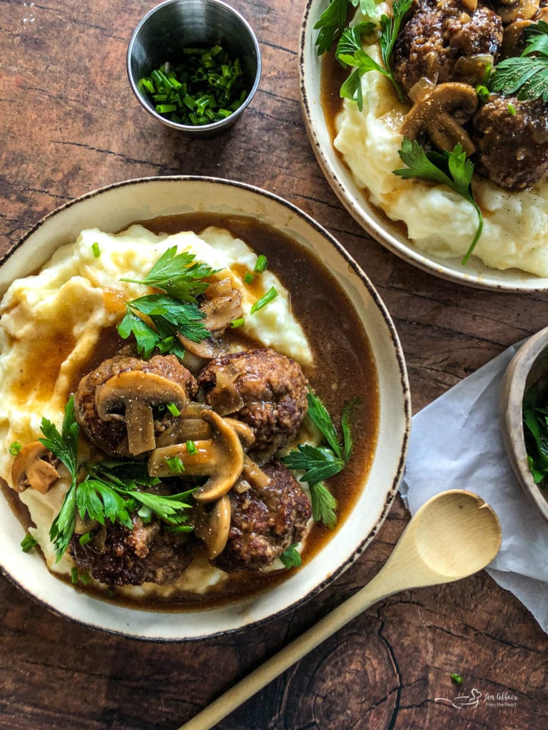 Tender Salisbury Steak Meatballs Served over Fluffy Mashed Potatoes