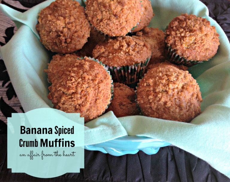 Banana Spice Crumb Muffins in a blue bowl lined with a green cloth napkin