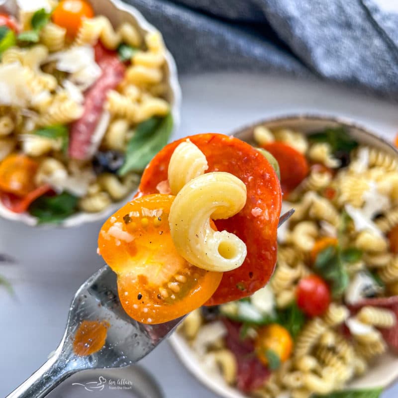 Close up photo of pasta salad on fork