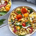 Two bowls filled with antipasto pasta salad