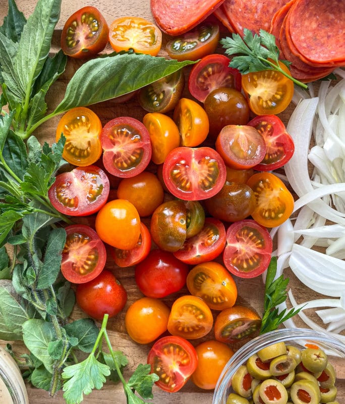 tomatoes on wooden cutting board