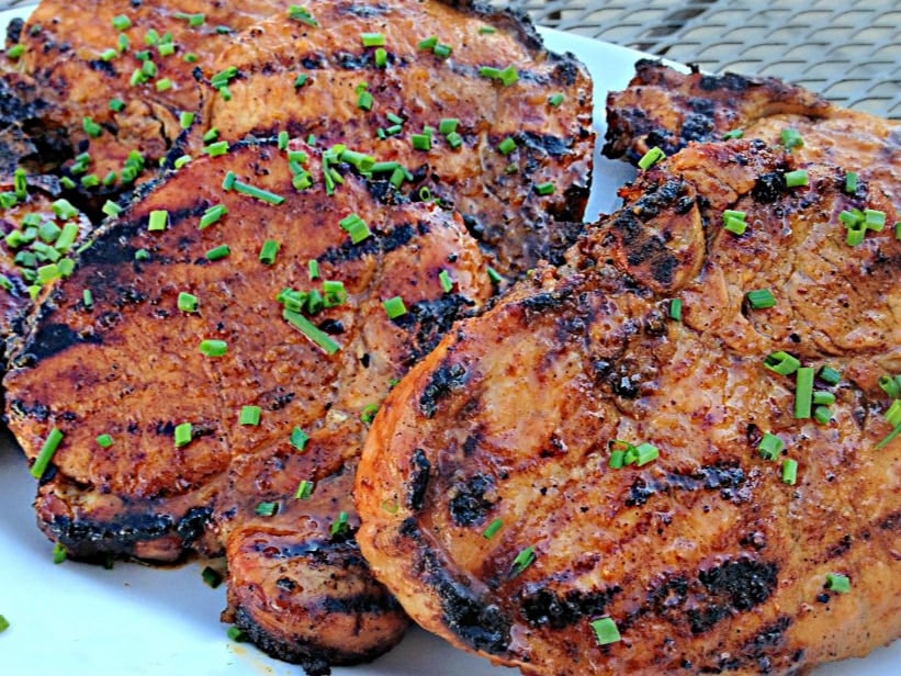 Apple Moonshine Glazed Pork Chops on white plate