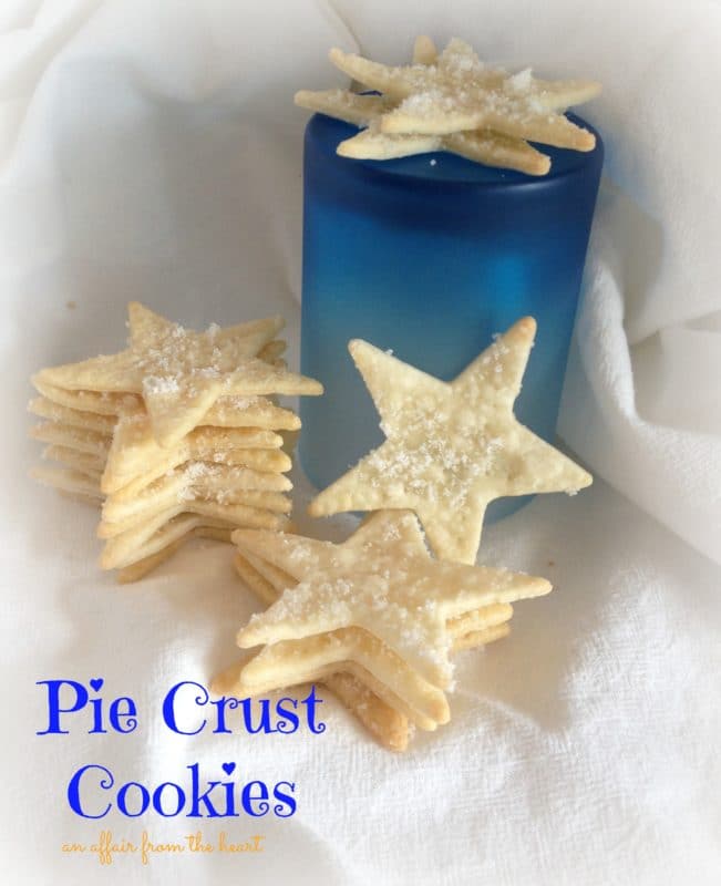 star shaped cookies on a white cloth with text "pie crust cookies"