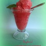 watermelon sorbet in a sundae glass with a spoon