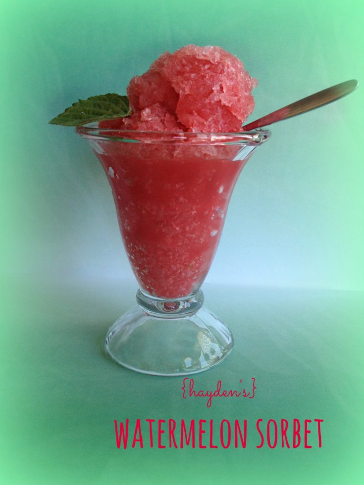 watermelon sorbet in a sundae glass with a spoon