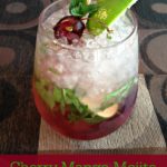 cherry mango mojito in a glass with lime wedge and cherries with text "cherry mango mojito"