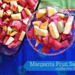overhead of margarita fruit salad in a margarita glass with text "margarita fruit salad"