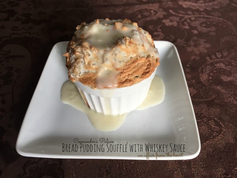 Bread Pudding Soufflé with Whiskey Sauce on a white plate