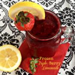 Lemonade in a glass mug with text "frozen triple berry lemonade"