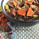 Vegetable Beef, Barley & Mushroom Soup in a black bowl