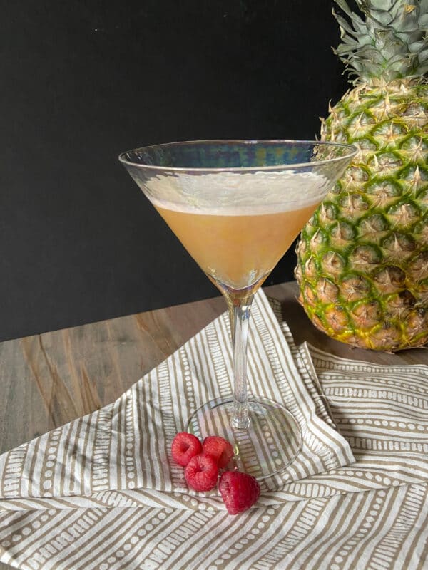 French martini cocktail next to a pineapple