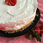 Strawberry Cheesecake Ice Cream Torte on a black plate