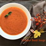 Overhead of Tomato Basil Soup in a white bowl with text "Tomato Basil Soup"