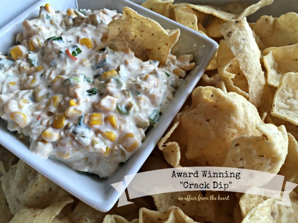 Dip in a white serving dish with chips around it and text "award winning crack dip"