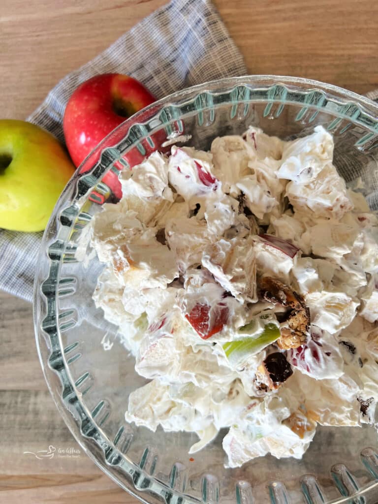 close up of apple snicker salad in a clear serving bowl