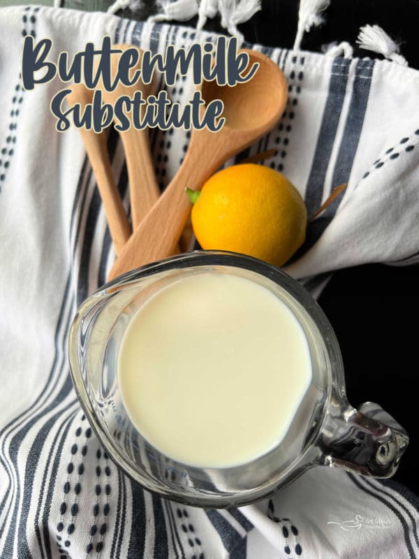 Buttermilk Substitute image with milk and lemon and measuring spoons
