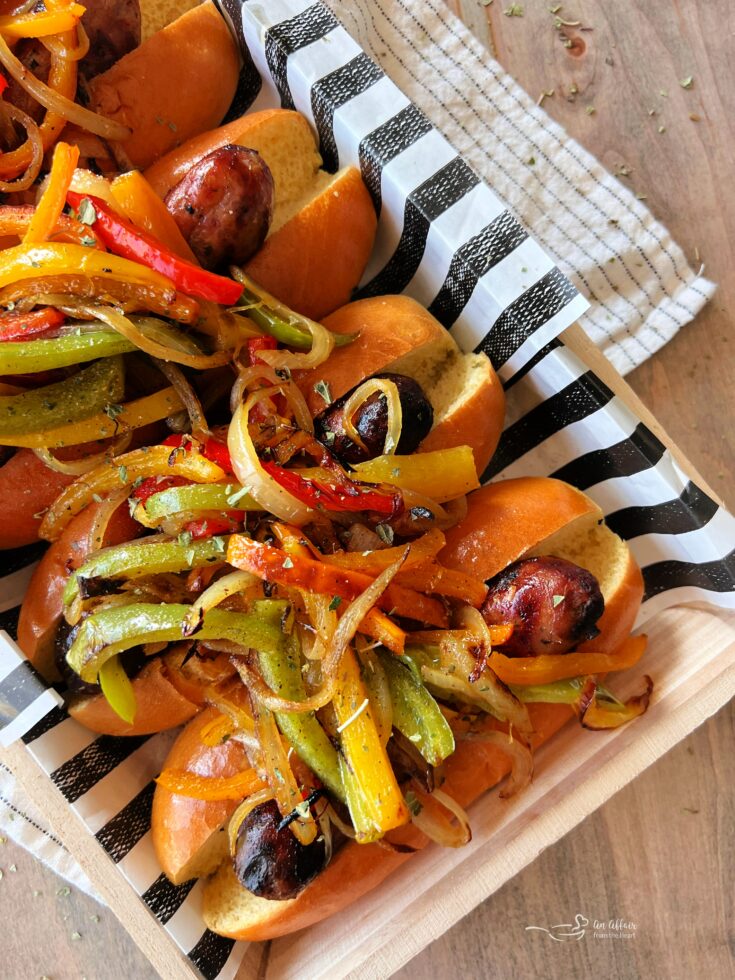 Italian Sausage with Peppers & Onions lined upon a decorative plate