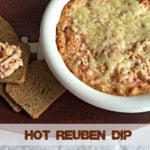 Dip in a white pot and a scoop on rye toast with text "Hot Reuben Dip"