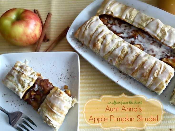 Apple Pumpkin Strudel on a white serving plate and a slice on a white plate with text "Aunt Anna's Apple Pumpkin Strudel"