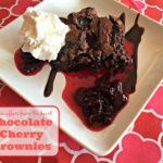 chocolate cherry brownie on a white plate with text "Chocolate Cherry Brownies"