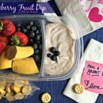 blueberry fruit dip and a variety of fruits in a container with text "blueberry fruit dip"