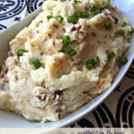 Potatoes in a white serving dish with text "Loaded Mashed Potatoes"