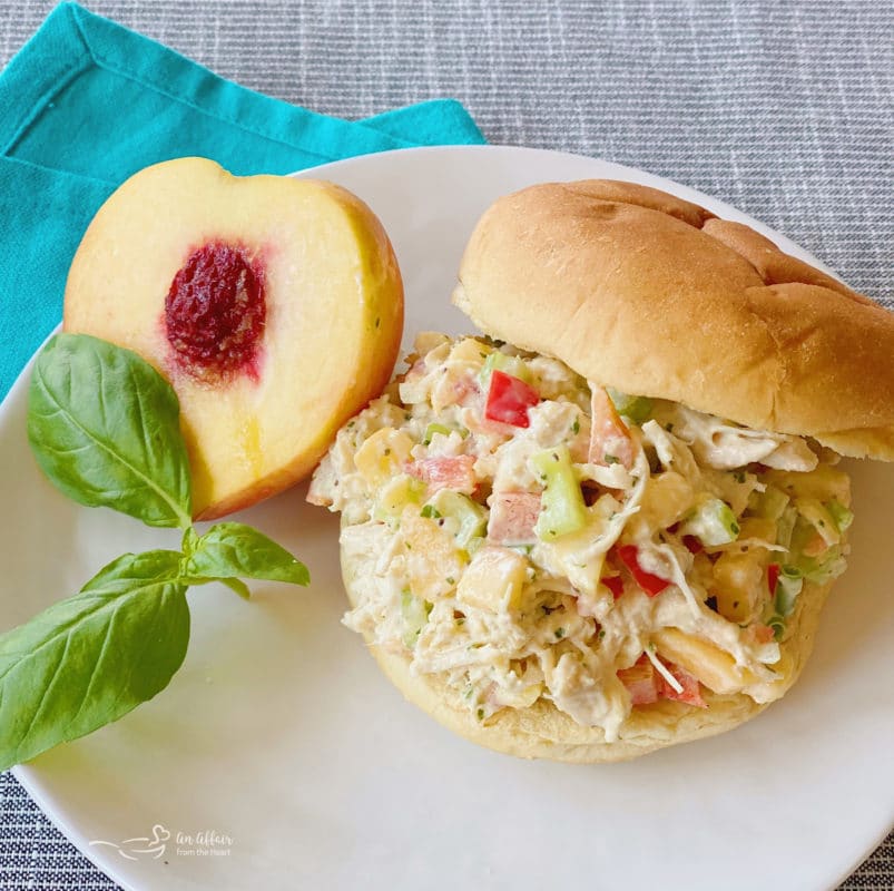 sandwich on white plate with peach