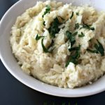 close up of cauliflower mash in a white bowl