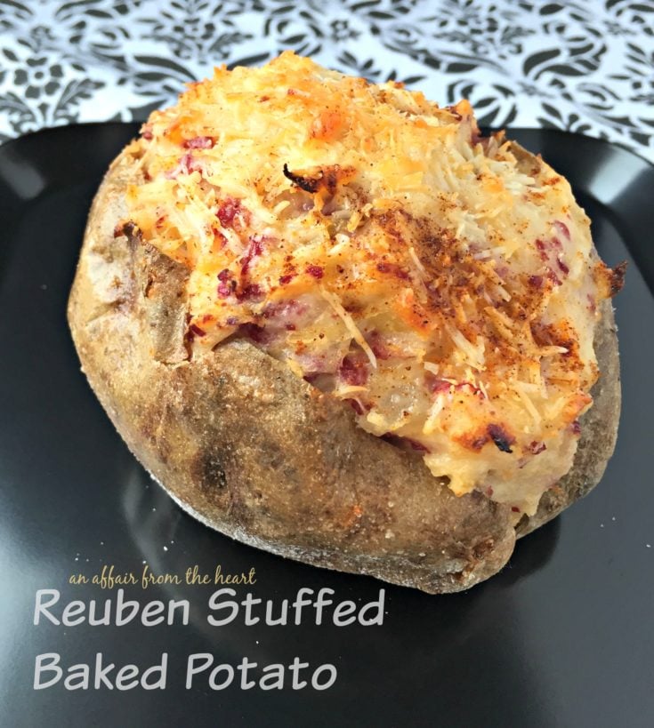 close up of Reuben Stuffed Baked Potato on a black plate