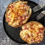 Close up of 2 Reuben stuffed baked potatoes