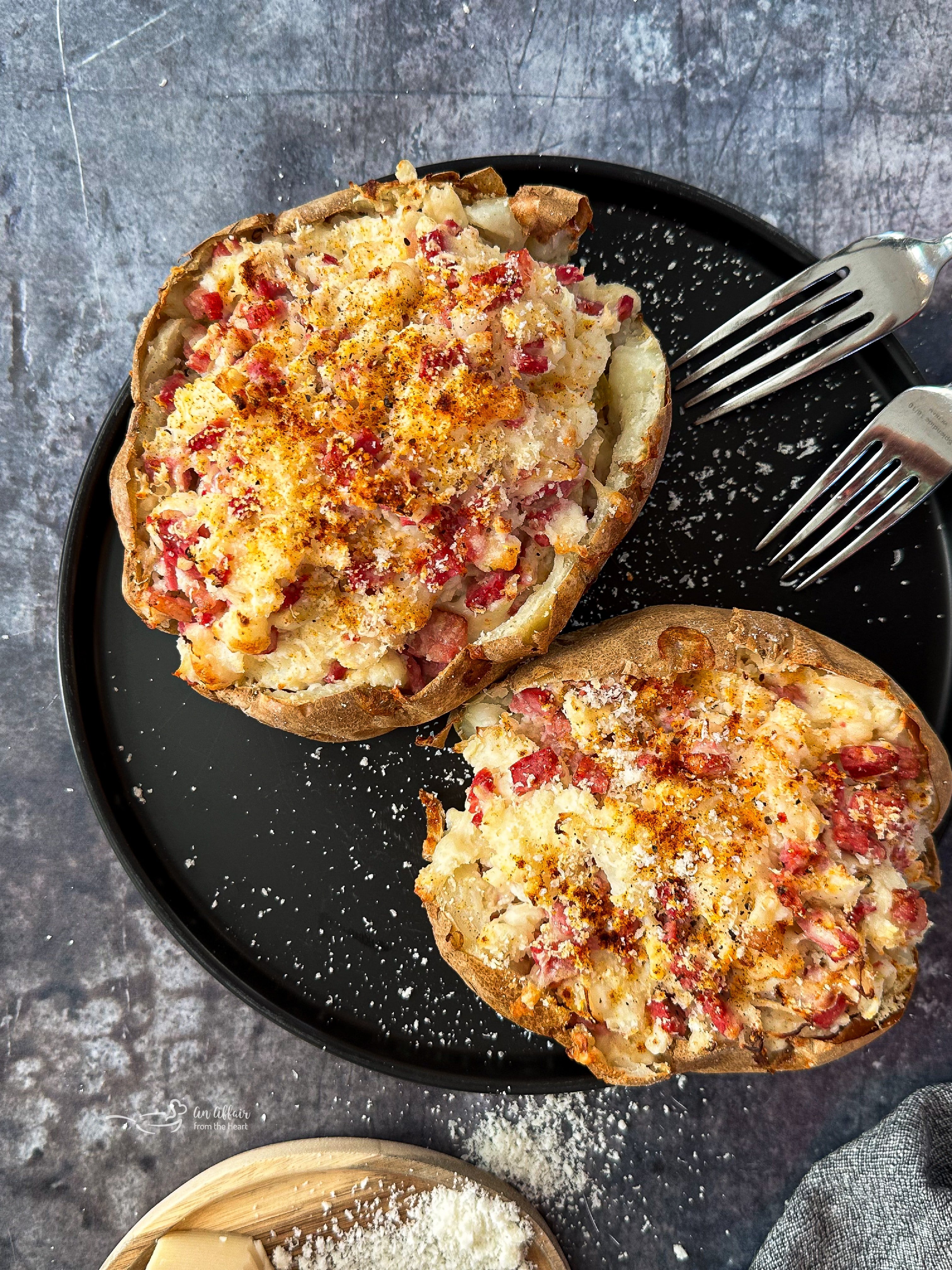 Close up of 2 Reuben stuffed baked potatoes