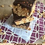 Chewy Chocolate Peanut Butter Bars stacked on a napkin