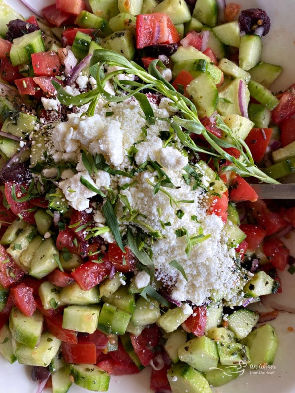 Top view of Greek cucumber salad with salt and oregano 