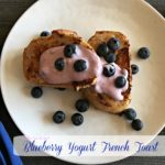 overhead of french toast on a white plate with text 'Blueberry Yogurt French Toast"