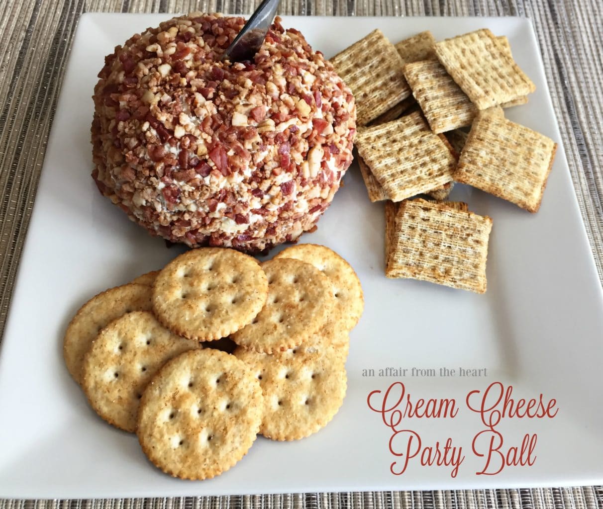 Close up of Cream Cheese Party Ball and crackers on a white plate