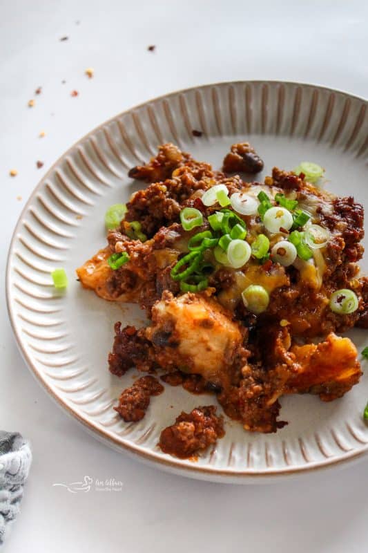 Bubble Up Enchiladas on a scalloped plate.