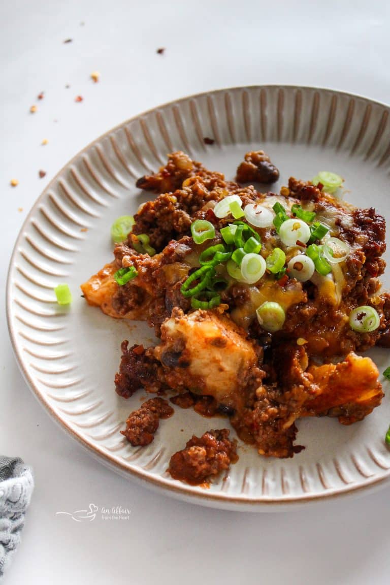 Bubble Up Enchiladas on a scalloped plate.