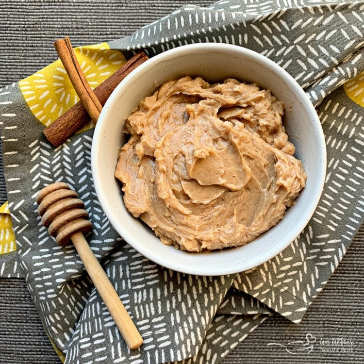 Overhead of Copycat Texas Roadhouse Cinnamon Honey Butter in a white serving bowl