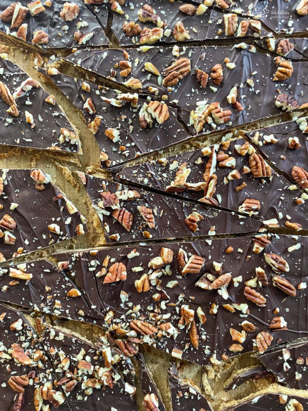 broken up pieces of graham cracker toffee brittle with pecans and chocolate 