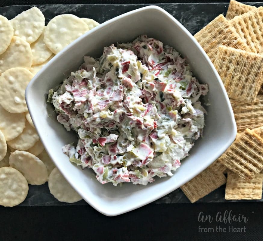 overhead of Dill Pickle Dip in a white serving dish with crackers around it