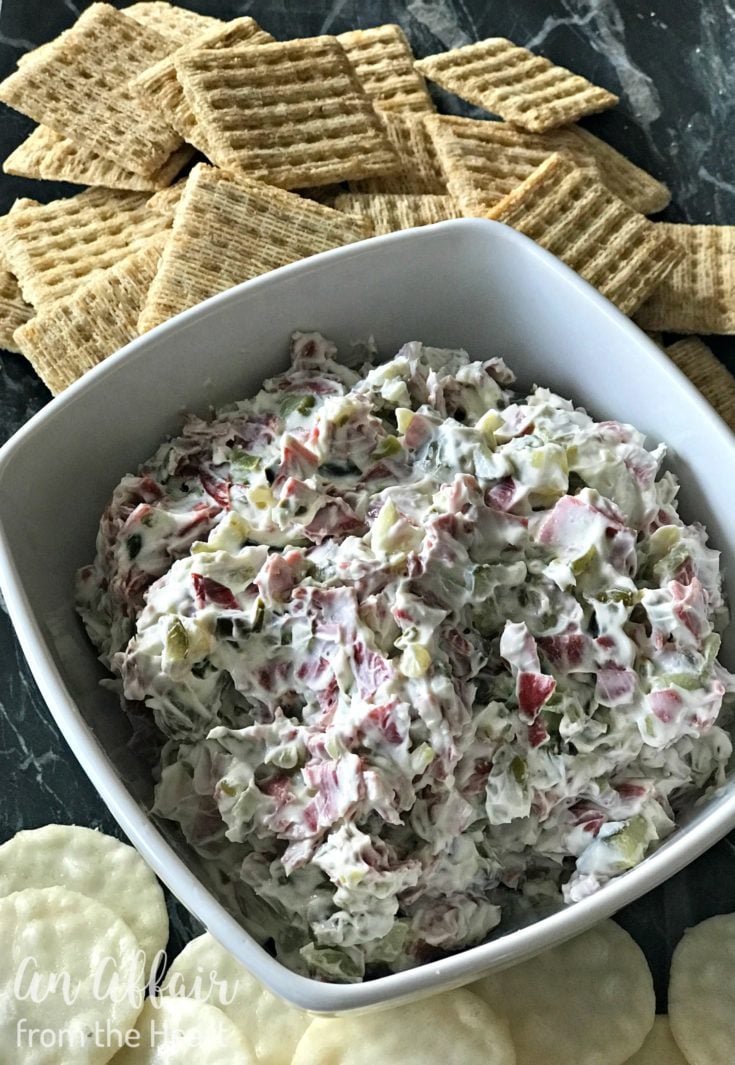 Dill Pickle Dip in a white serving dish with crackers around it