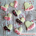 Valentine Dipped Shortbread Cookies on a wood surface