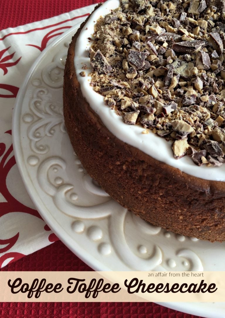 Cheesecake on a cake plate with text "Coffee Toffee Cheesecake"