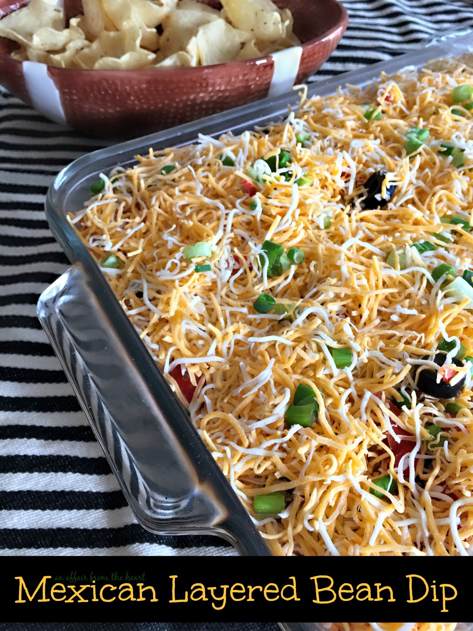 Overhead of Mexican Layered Bean Dip with text " Mexican Layered Bean Dip"