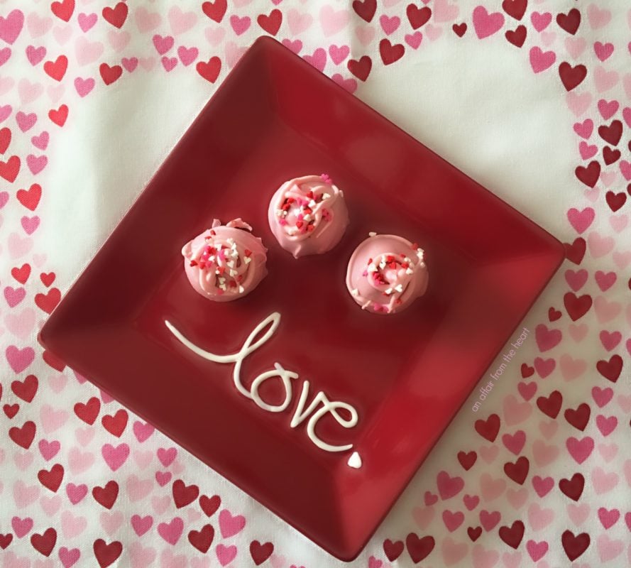 Oreo Truffles on a red plate that says love