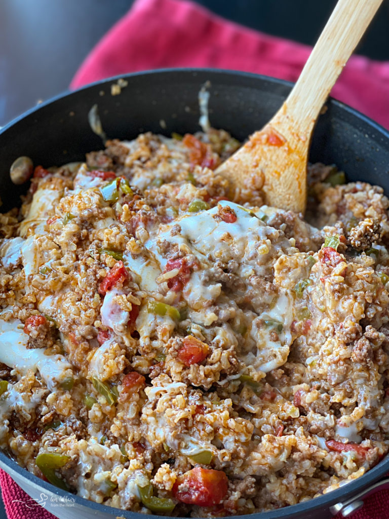 Stirring the cheese into Stuffed pepper skillet